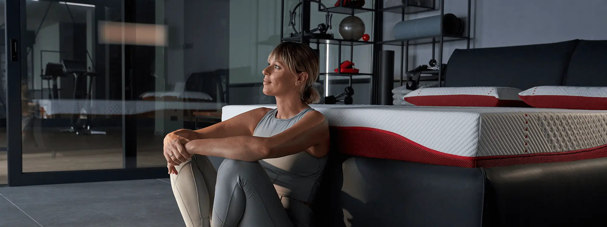 Federica Pellegrini sitting next to the Dorelan ReActive mattress.